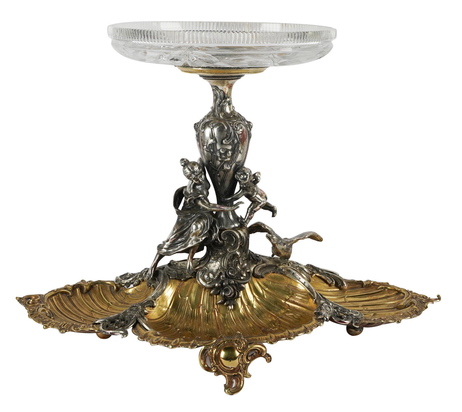 SILVERPLATE FIGURAL CENTERPIECE: unmarked; with associated cut- glass bowl; Condition: rubbed wear to plate; glass cracked; 24 inches wide; 18 inches deep; 17 inches high;