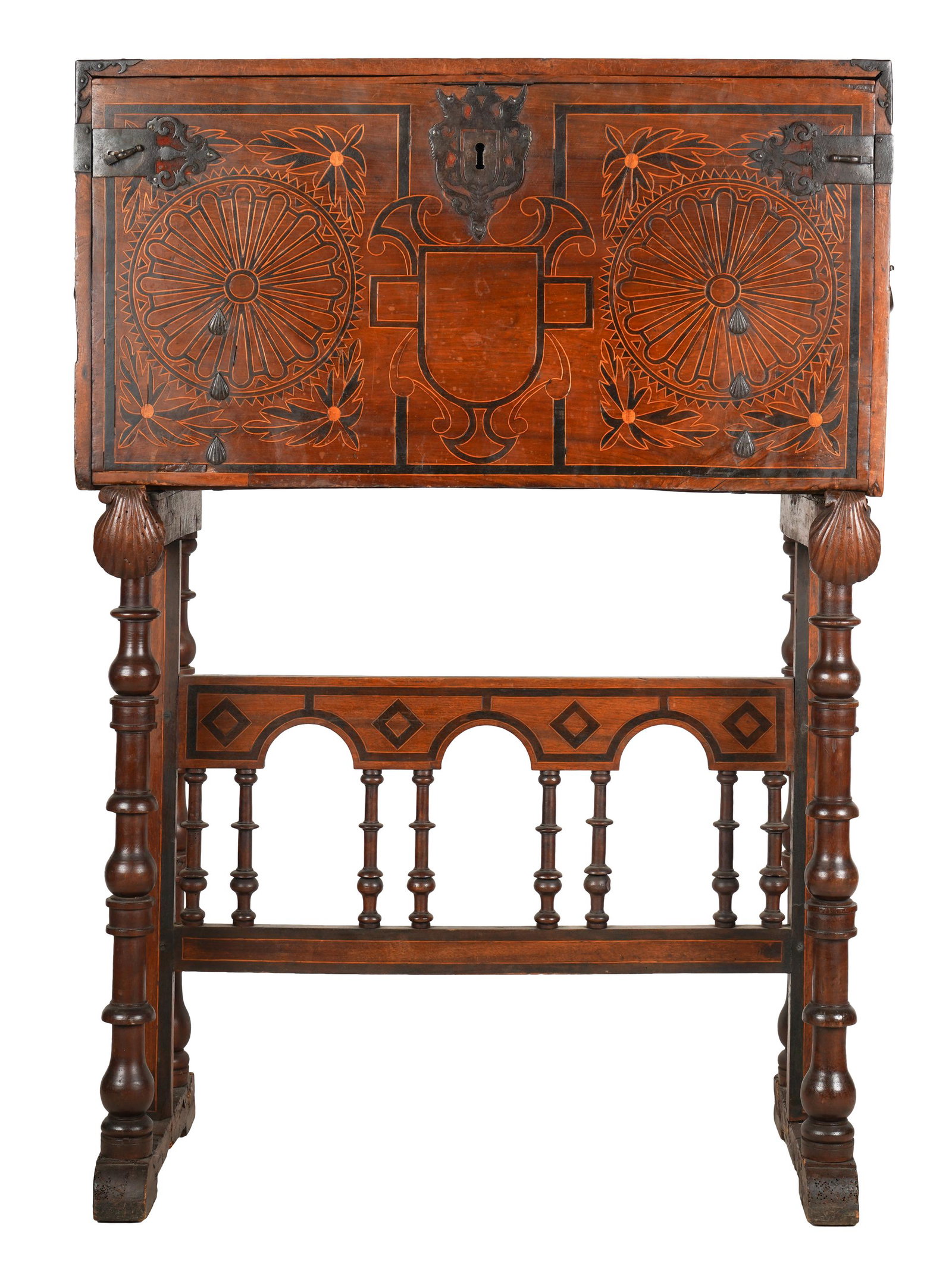 SPANISH RENAISSANCE-STYLE VARGUENO: in two parts; the upper section with a fall front door enclosing an arrangement of drawers and a cupboard; 39 inches wide; 18 inches deep; 54 1/2 inches high