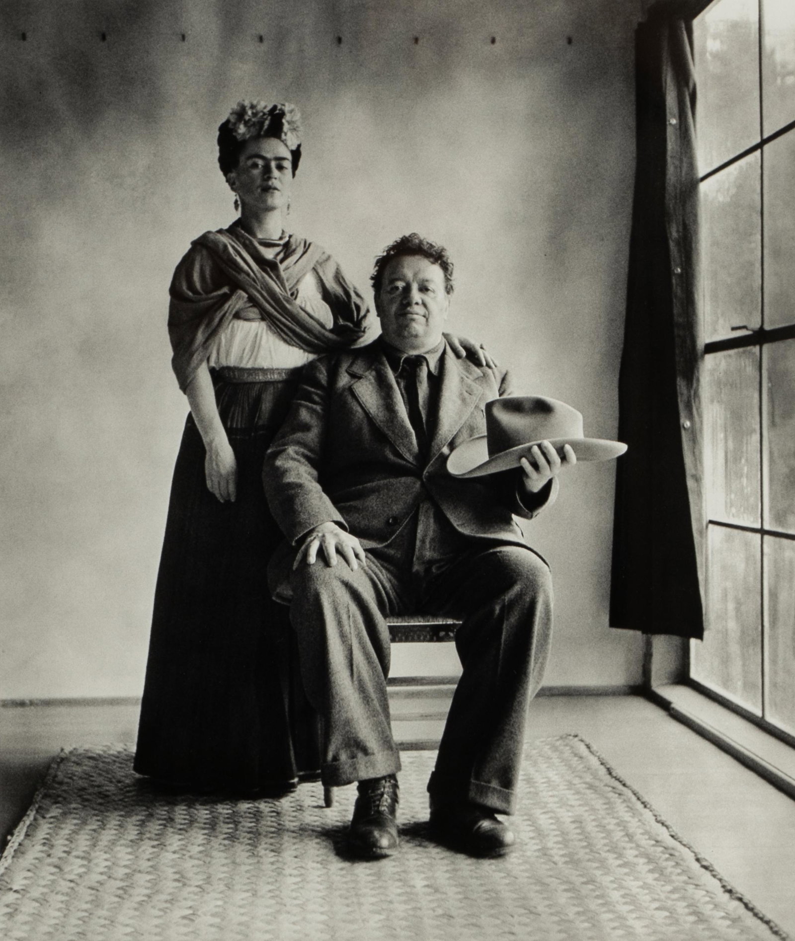 NICKOLAS MURAY (1892â€“1965): FRIDA & DIEGO WITH HAT: platinum print, matted and framed under acrylic; numbered 15 to verso (out of an edition of 100), printed by Bruce Proctor; Provenance: Property from an Important California Estate; 13 x 11 inches ima