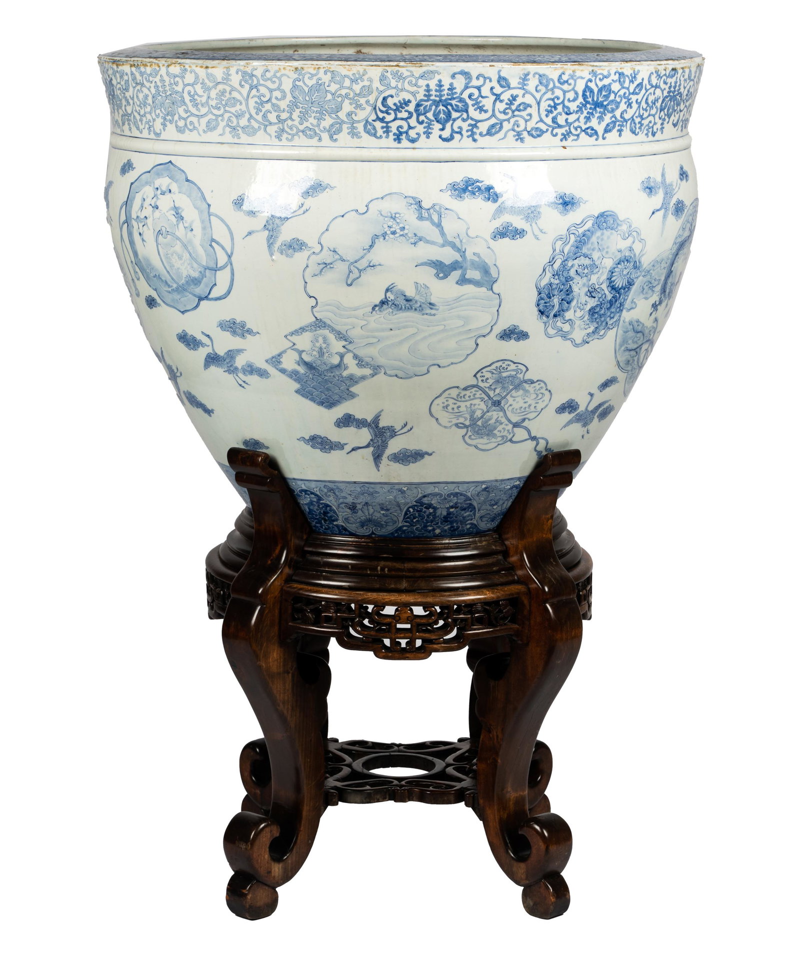 MONUMENTAL JAPANESE BLUE & WHITE PORCELAIN FISHBOWL: not drilled; with wooden stand; Provenance: The Mrs. Stuart Davis Collection, Beverly Hills, CA; 35 1/2 inches diameter; 28 inches high; total height: 50 1/2 inches