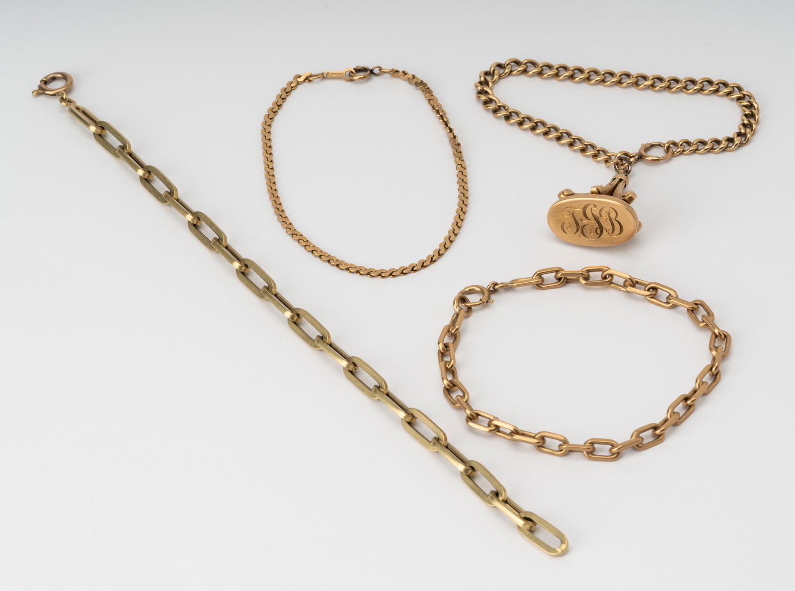 FOUR ASSORTED 14 KARAT YELLOW GOLD BRACELETS (1 of 9)