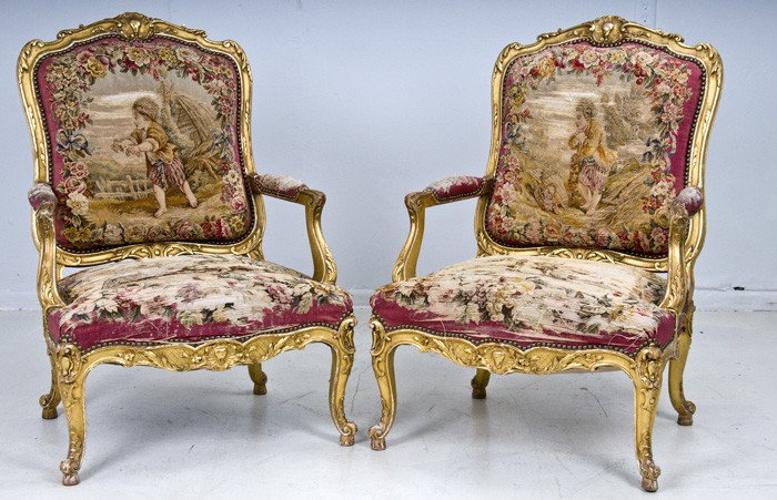 PAIR OF FRENCH GILTWOOD FAUTEUILS: in the Louis XV style, each cartouche-shaped back and seat upholstered in Aubusson tapestry Condition: with wear and loss to the seats