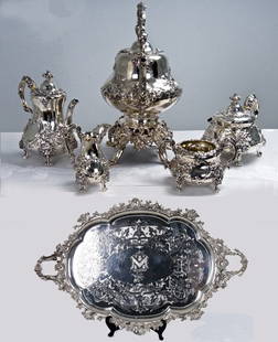 FIVE-PIECE VICTORIAN ROCOCO REVIVAL SILVER TEA AND: Tea Service: Edward & John Barnard, London, 1859-60 comprising of a kettle on stand, coffee pot, teapot, creamer, and open sugar bowl each elaborately chased piece with foliate scrolls, masques, and a