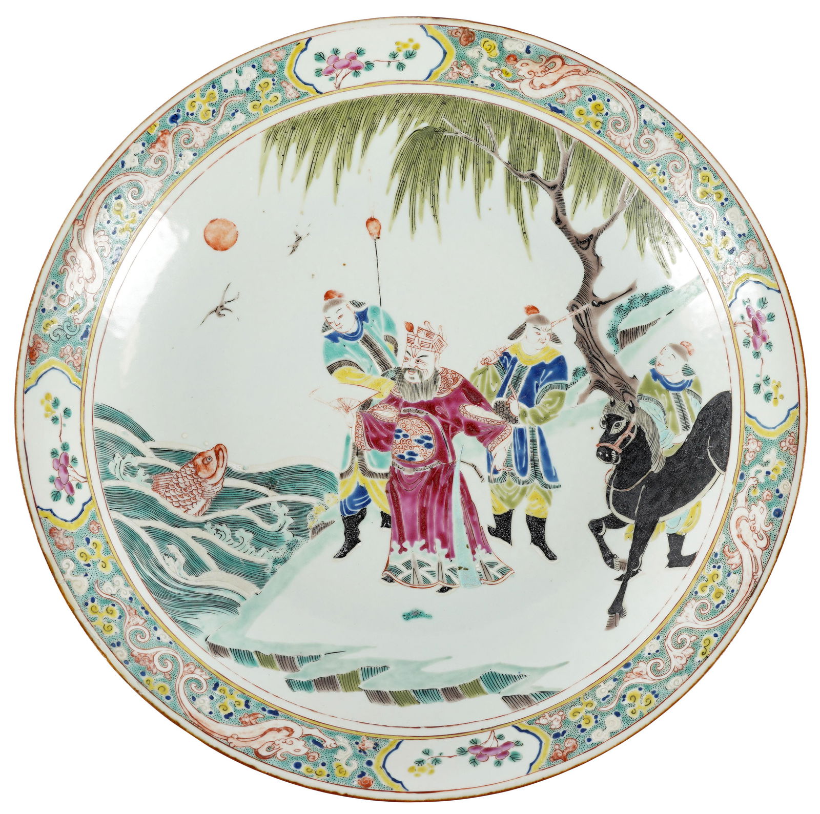 CHINESE FAMILLE VERTE PORCELAIN CHARGER: unsigned; centered by a figure with guards in a landscape; Provenance: The Mrs. Stuart Davis Collection, Beverly Hills, CA; 14 1/8 inches diameter