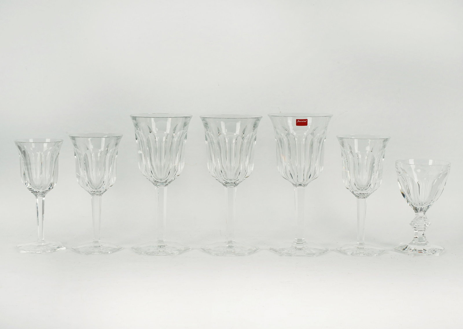ASSEMBLED GROUP OF BACCARAT CRYSTAL STEMWARE: each marked; comprising 12 "Malmaison" tall water goblets, including two in original boxes (8" high); two "Malmaison" water goblets (one 7 7/8' high, one 7 3/4" high); 12 "Malmaison" claret wine glass