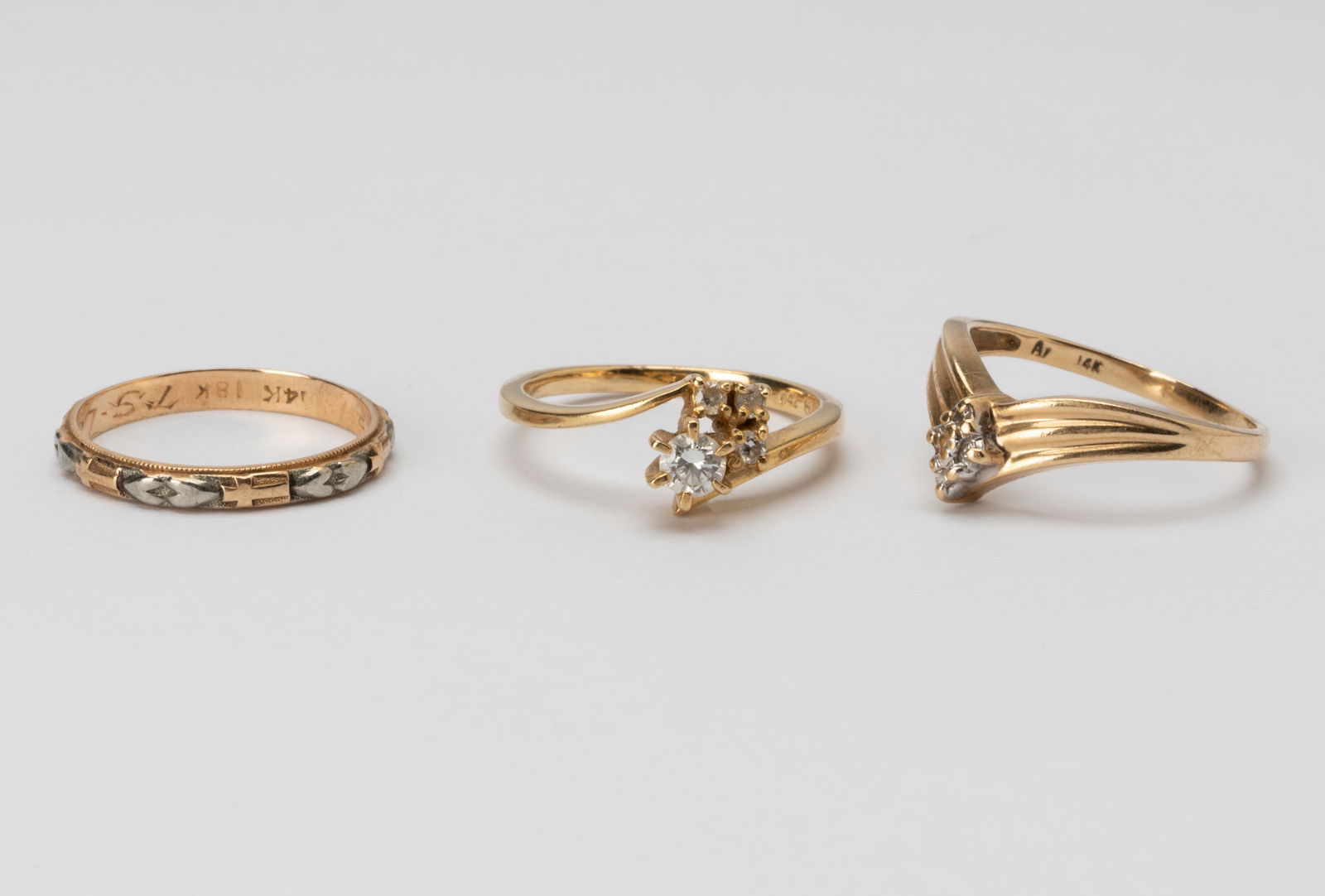 THREE GOLD & DIAMOND RINGS (1 of 5)