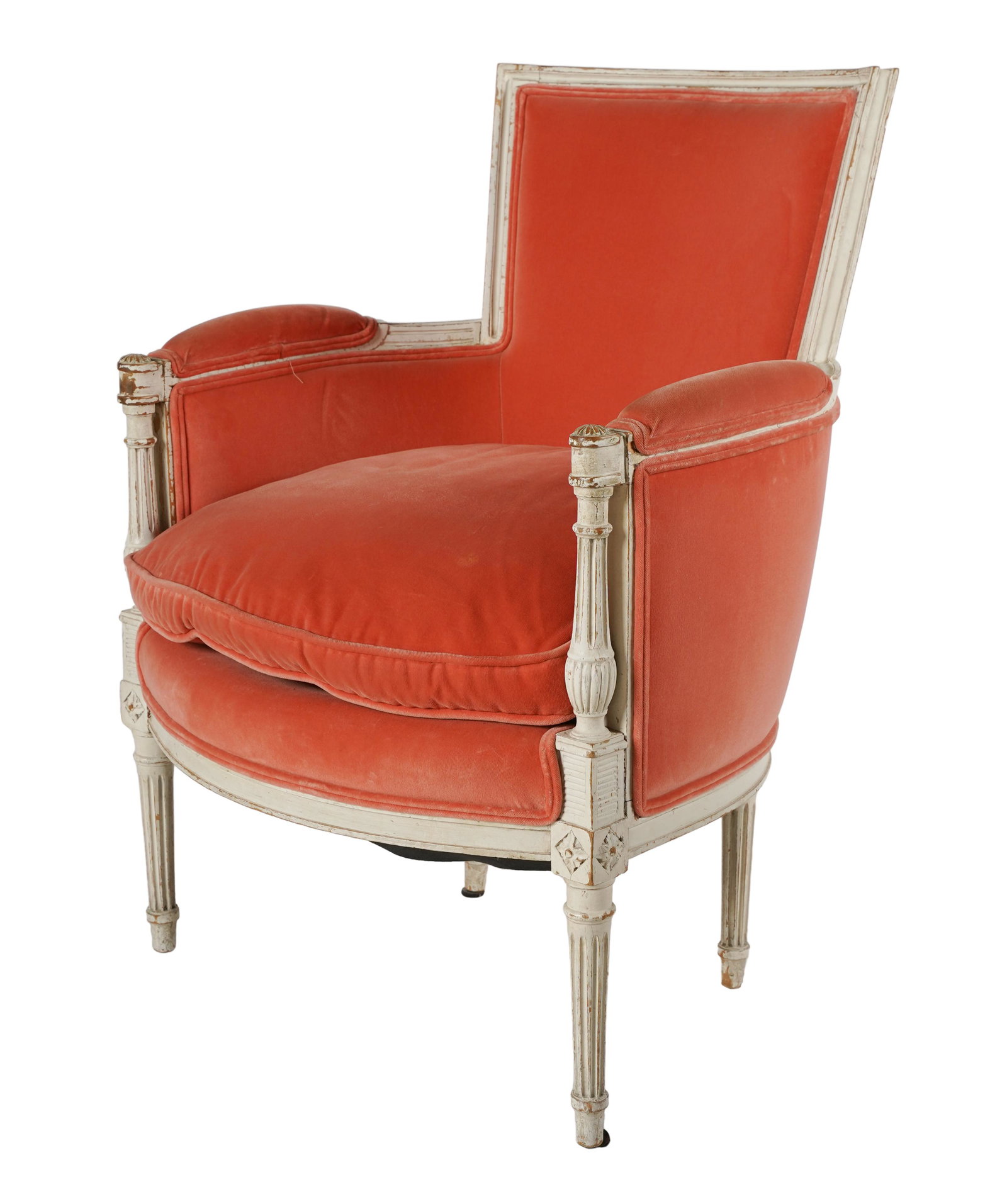 LOUIS XVI-STYLE WHITE-PAINTED BERGERE: covered with coral-colored velvet; 25 1/2 inches wide; 23 inches deep; 35 inches high; seat height: 17 inches
