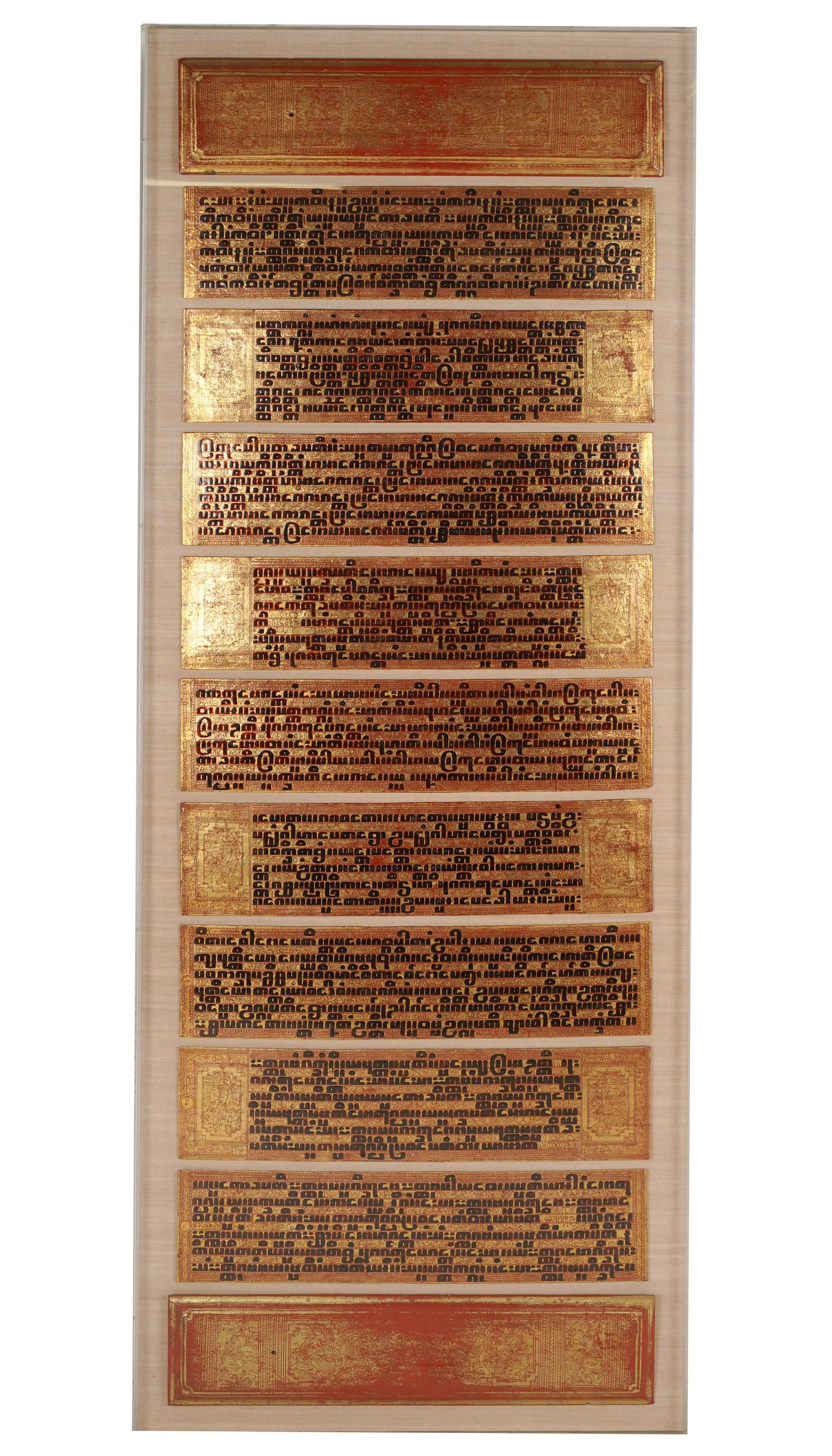 FRAMED SOUTHEAST ASIAN INSCRIBED PANELS: comprising nine gilt panels, mounted to linen board, in a single acrylic frame; 68 x 27 inches frame