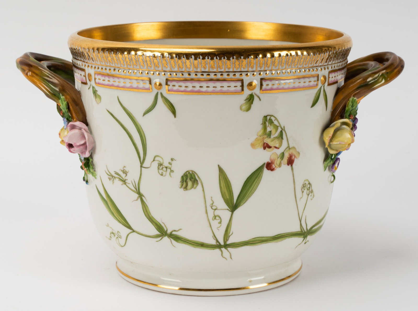 Royal Copenhagen Porcelain "Flora Danica" Round Wine Cooler: blue wave and green crown marks; shape number 3571, pattern number 20, botanical specimen identified in Latin; flanked by branch-form handles with floral terminals 6 1/2 x 7 1/4 in. (16.5 x 18.4 cm.) 