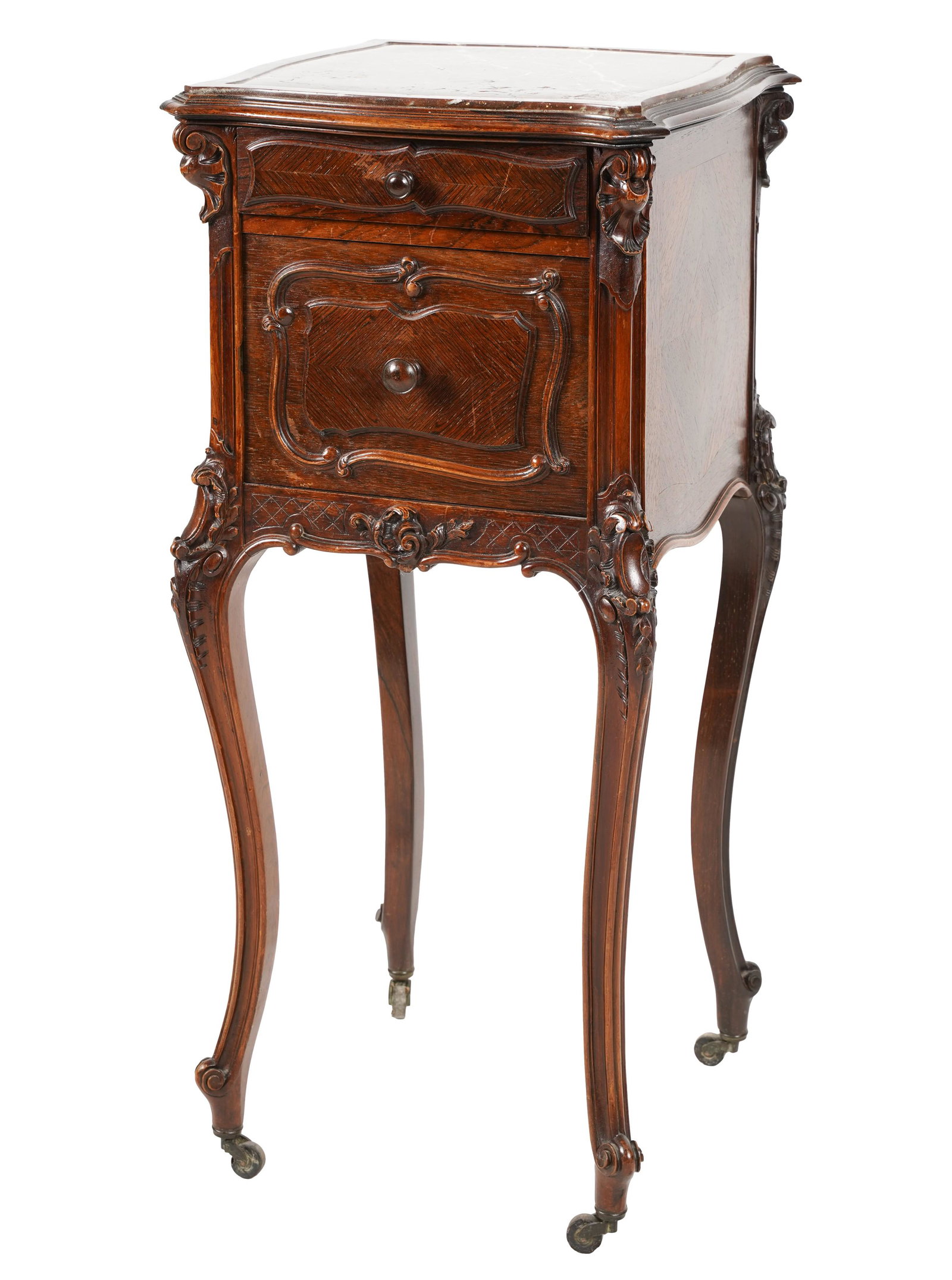 Louis XV-Style Carved Mahogany Nightstand: with a marble top over a single drawer above a hinged door enclosing a marble lined interior, raised on metal casters 32 1/2 x 14 1/4 x 14 1/4 in. (82.6 x 36.2 x 36.2 cm.)
