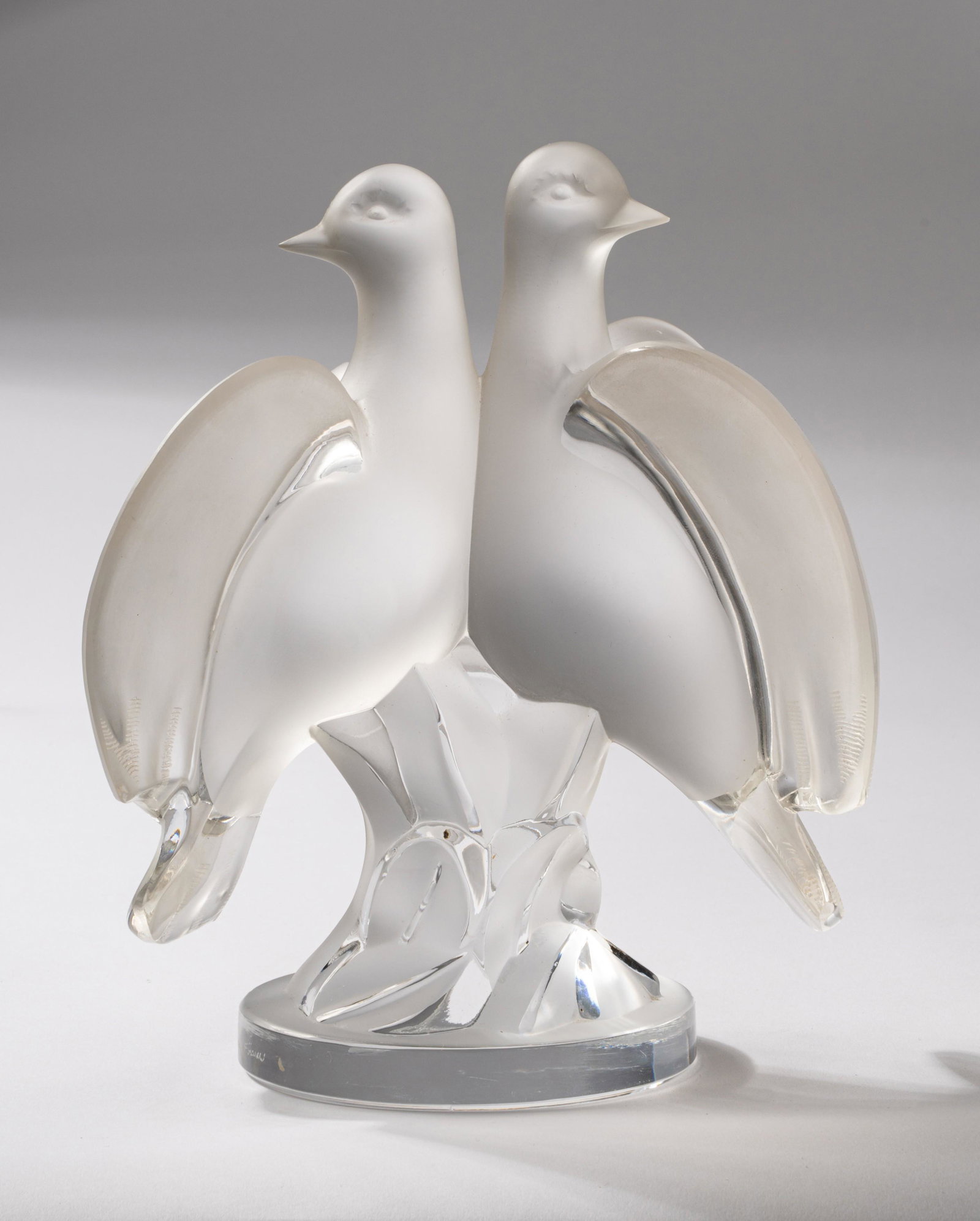 Lalique "Ariane" Molded Glass Dove Figural Group: signed "Lalique France" to base 8 3/4 x 7 x 4 3/4 in. (22.2 x 17.8 x 12.1 cm.)