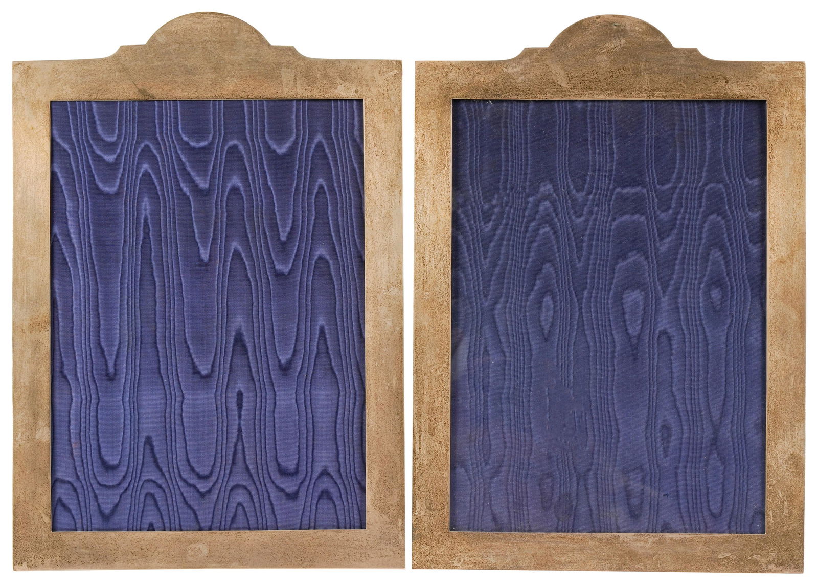 Louise Fletcher-Two English Sterling Easel-Back Frames: Henry Hudson Plante, Birmingham, 1937; each with blue silk moire lining and green leather backing; 14 1/4 x 10 in. (36.2 x 25.4 cm.); each opening 11 x 8 in. (27.9 x 20.3 cm.)