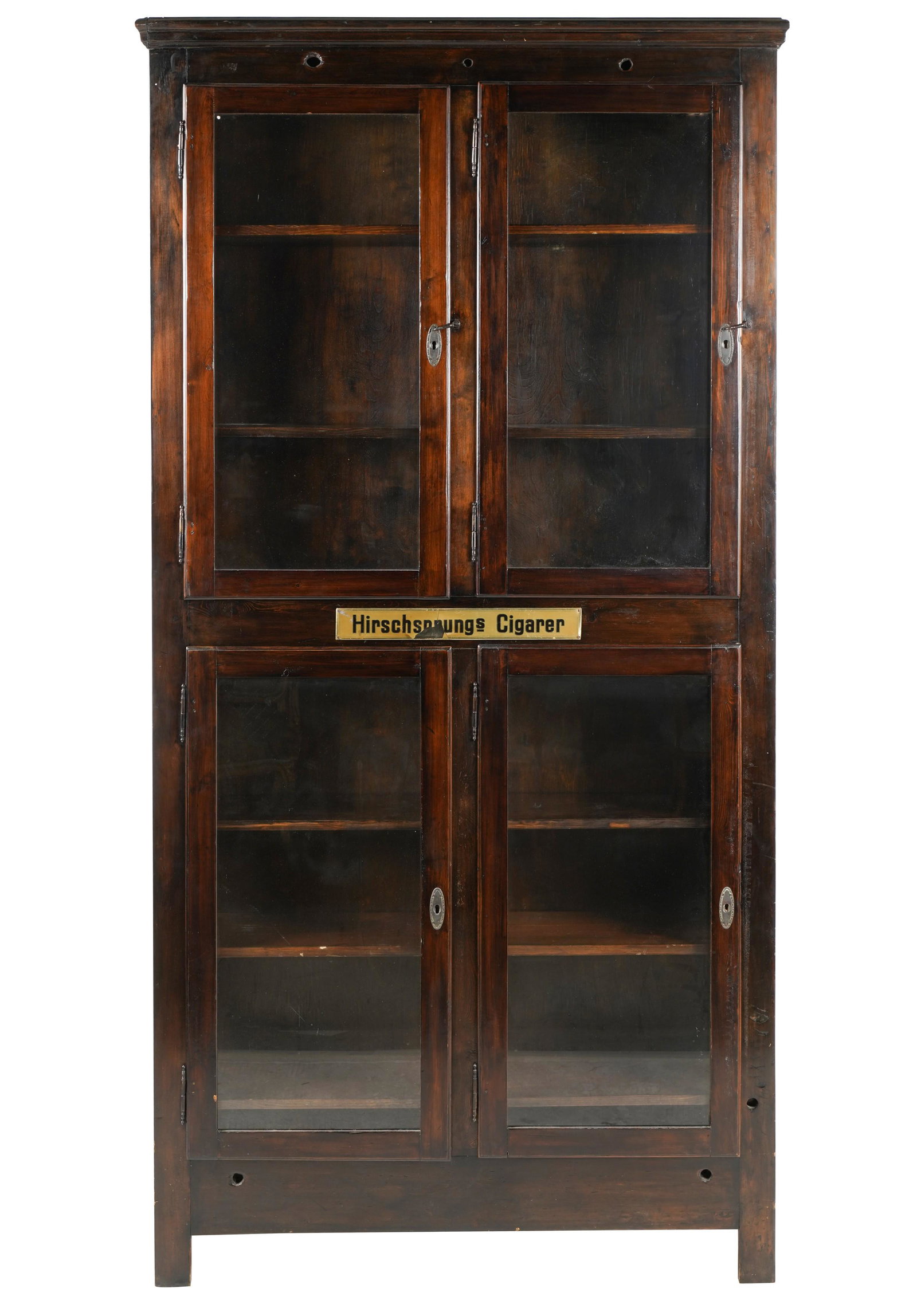 Louise Fletcher- Cigar Cabinet: 19th / early 20th century; having four glazed hinged doors and six shelves 93 1/2 x 48 x 12 in. (237.5 x 121.9 x 30.5 cm.)
