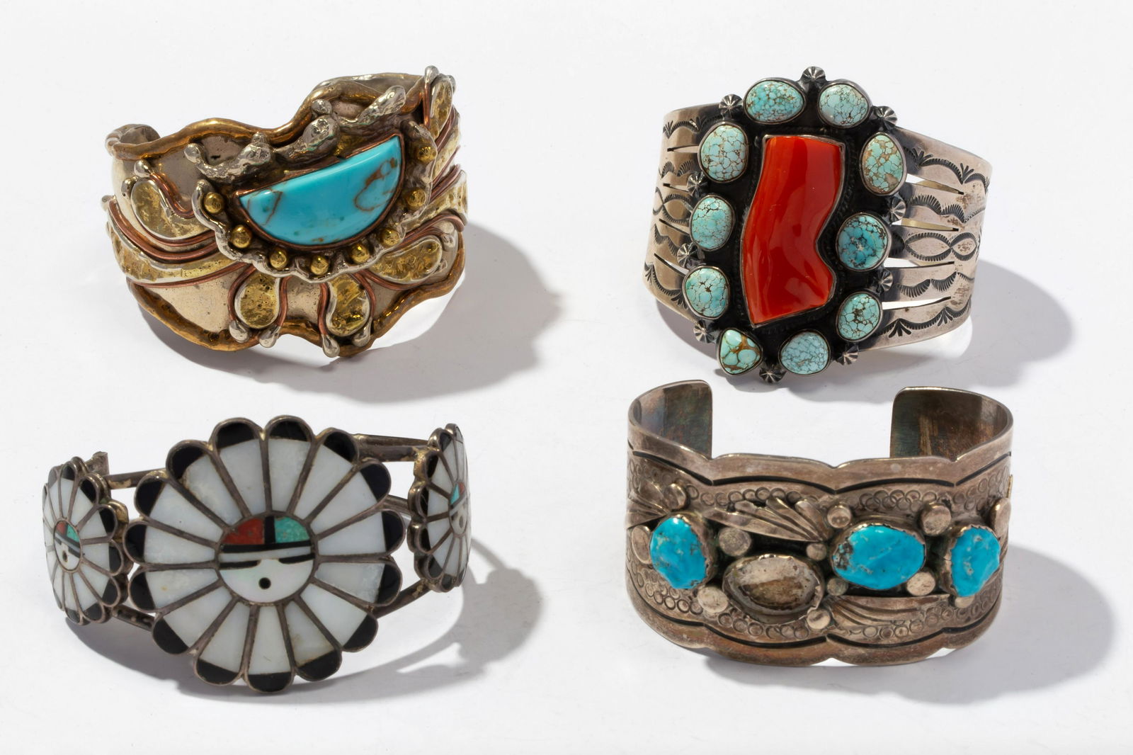 Connie Stevens- Four Sterling Silver, Mixed Metal and Multi-Stone Cuff Bracelets: Connie Stevens- Four Sterling Silver, Mixed Metal and Multi-Stone Cuff Bracelets Including a Zuni style sterling silver and gemstone inlay cuff bracelet with three “sun face” motifs in Turquoise,