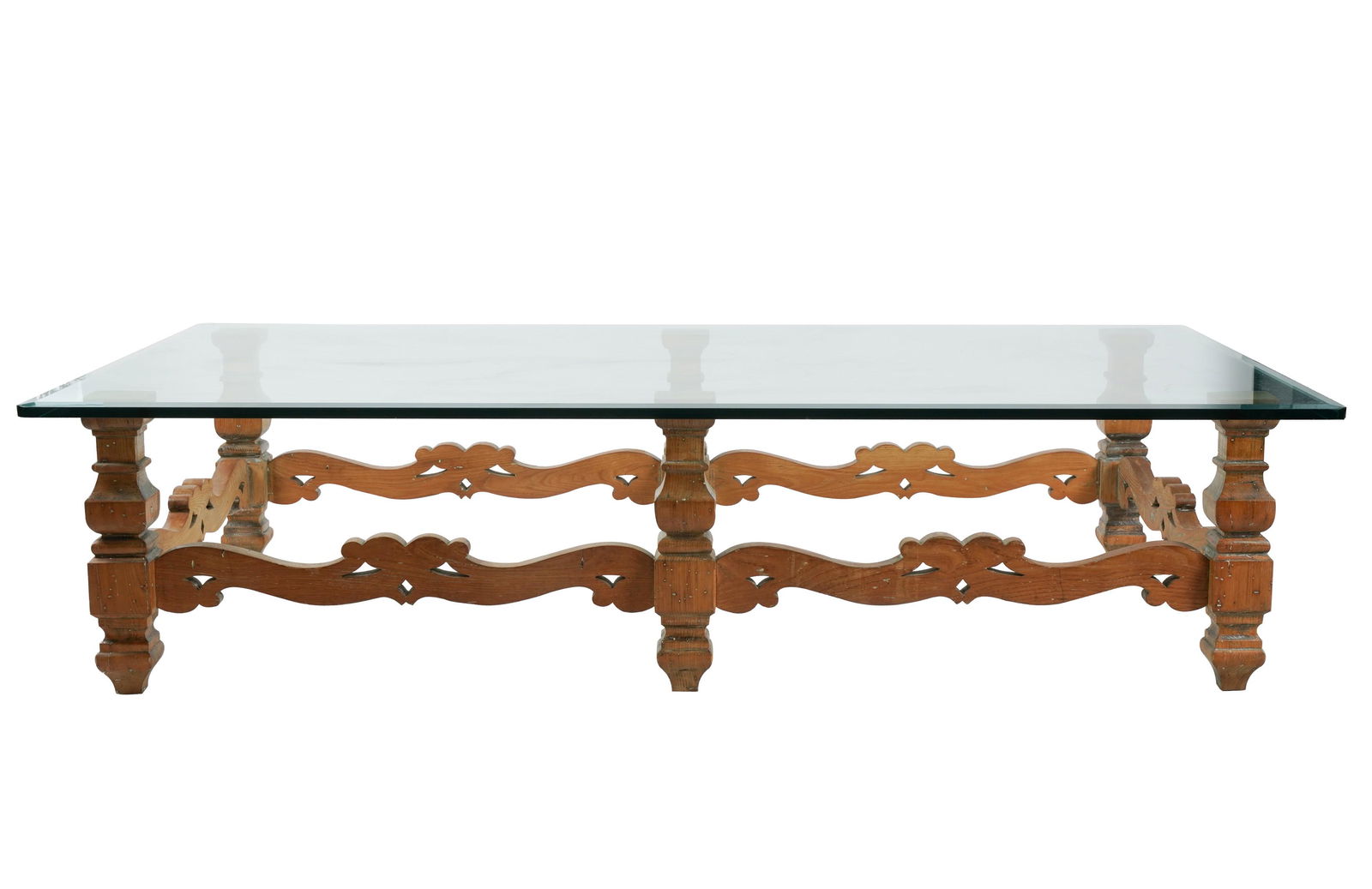 Connie Stevens- Rustic Glass-Top Coffee Table: pine wood base, with beveled glass 17 1/4 x 72 x 42 in. (43.8 x 182.9 x 106.7 cm.)