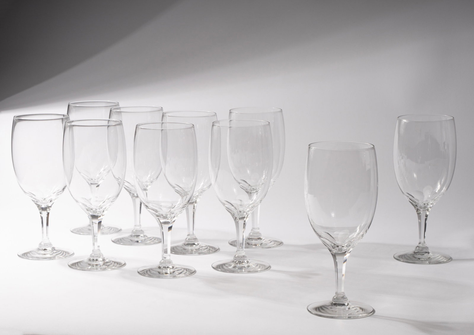Set of 12 Extra-Large Wine Glasses: unsigned 9 1/2 in. (24.1 cm.) high Provenance: Property from the personal collection of Tommy Church, a celebrated San Francisco, California landscape designer; the personal collection of Ed Hardy, Sa