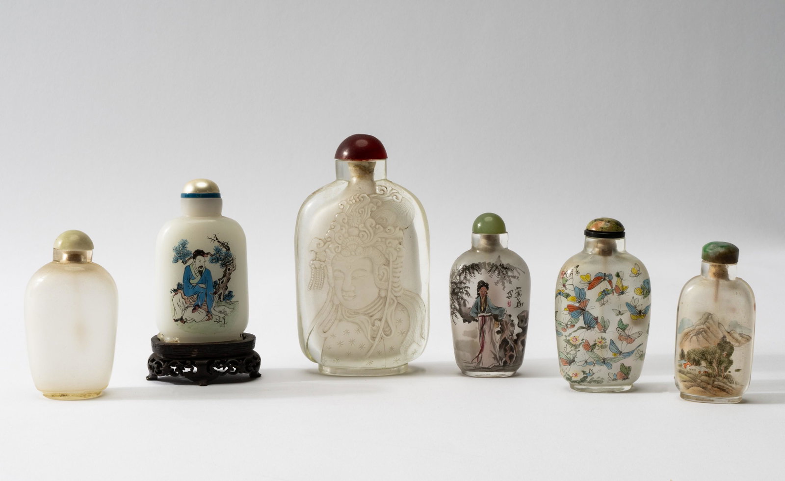 Six Glass Snuff Bottles: each with stopper ranging from 2 7/8 in. (7.3 cm.), to 4 3/4 in. (12.1 cm.)