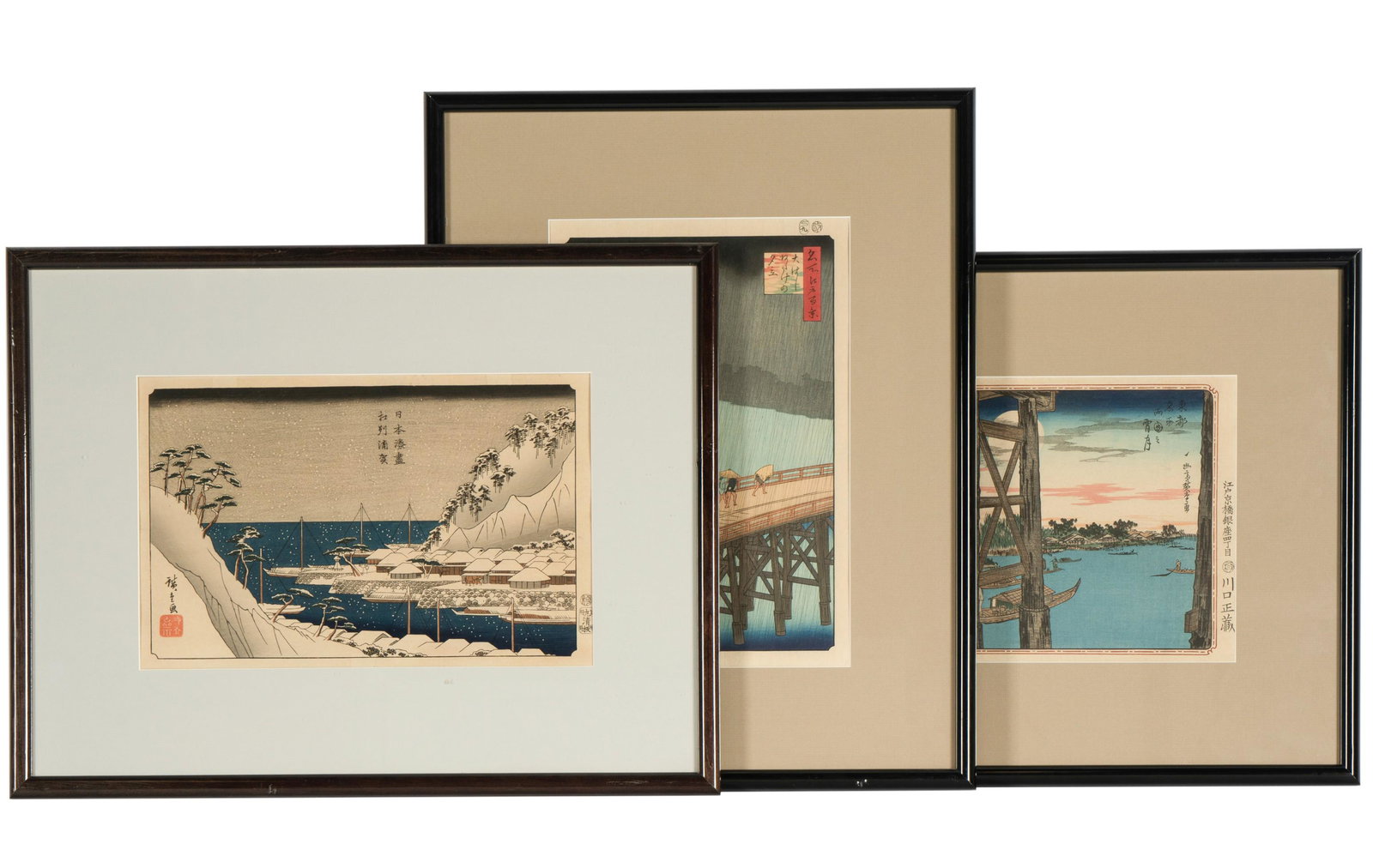 Three Adachi Japanese Woodblock Prints: each a reprint after HIroshige, published by Adachi, each matted, framed and glazed; the first: "Great Bridge - Sudden Showers at Atake", page 247 #260), the second: Twilight Moon (Ryogoku No Yoizuki)