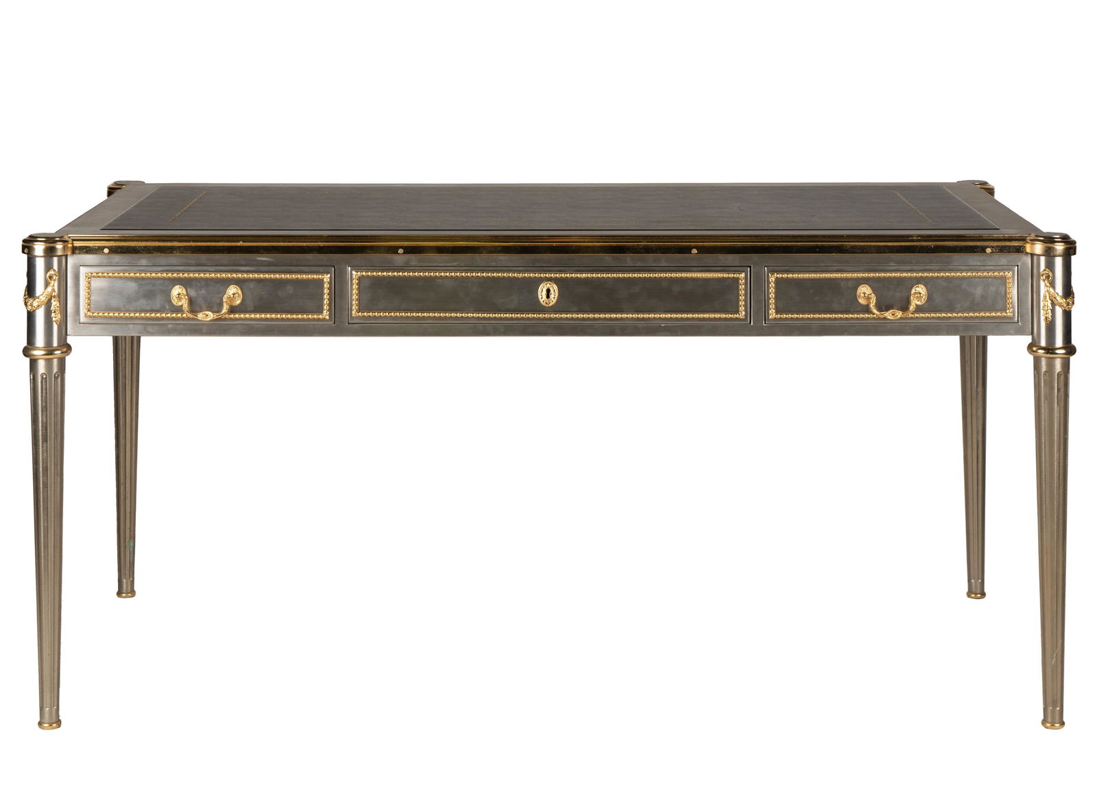 John Vesey (1924-1992): Louis XVI-Style Bureau Plat: circa 1960; stainless steel, gilt metal, and wood, with gilt-tooled leather-inset top 30 x 63 x 33 in. (76.2 x 160 x 83.8 cm.) Provenance: Property from the Personal Collection of Beverly Hills Design