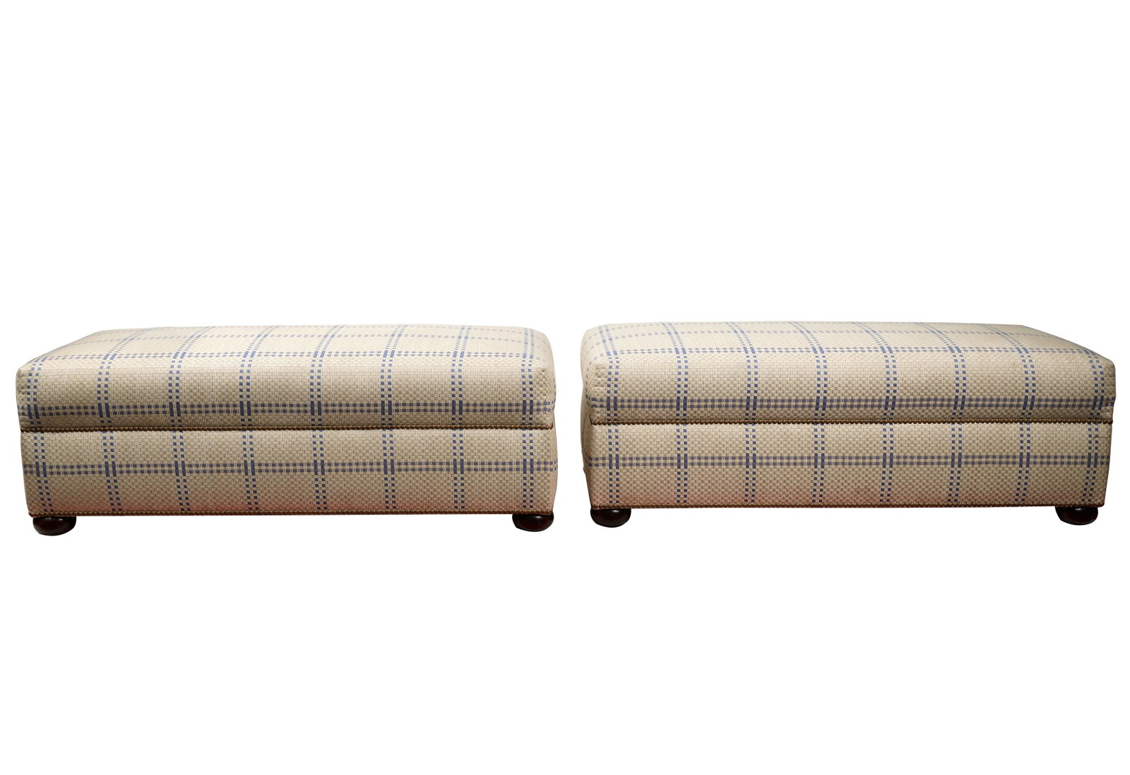 Pair of Cowtan and Tout Upholstered Benches: unsigned; covered in off-white and blue fabric with nail head trim, on stained wood bun feet 17 1/2 x 50 x 22 in. (44.5 x 127 x 55.9 cm.)