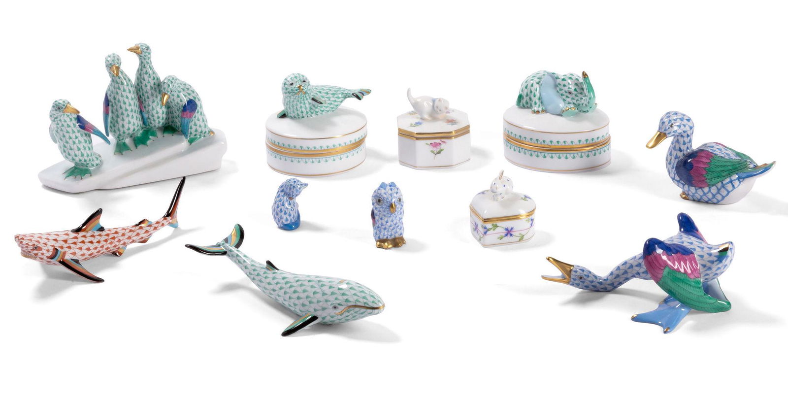 Collection of Herend Fishnet Porcelain Animal Figures and Boxes: each with factory marks; comprising a penguin group (4 1/2 x 6 x 2 1/2 in.); a whale (6 1/2 in. high); a shark (6 in. high); two ducks (one 5 in. wide, the other 3 5/8 in. wide); a cat (1 in. high); a