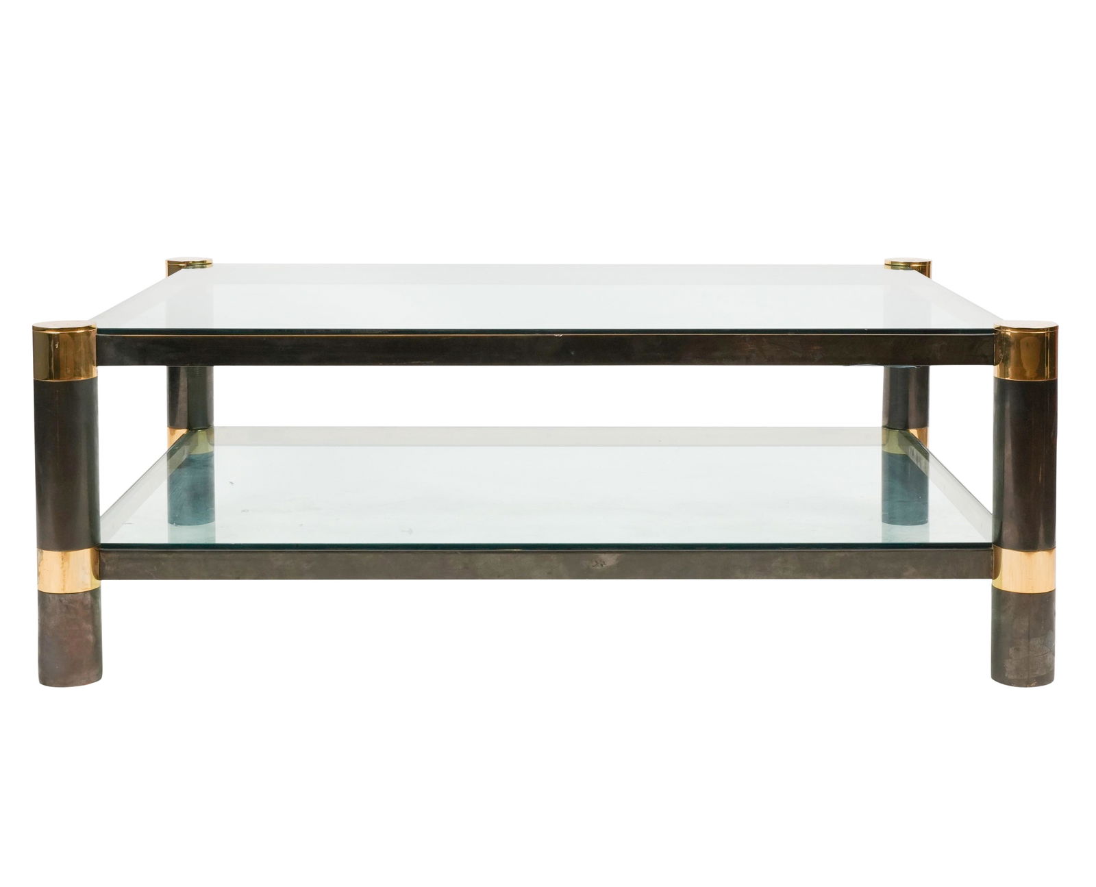 Karl Springer: Tiered Coffee Table: brass, gun metal finish over brass, and glass; unsigned 17 x 48 x 36 in. (43.2 x 121.9 x 91.4 cm.) Property from the personal collection of Jeff Schuerholz of Fat Chance, the iconic Los Angeles store