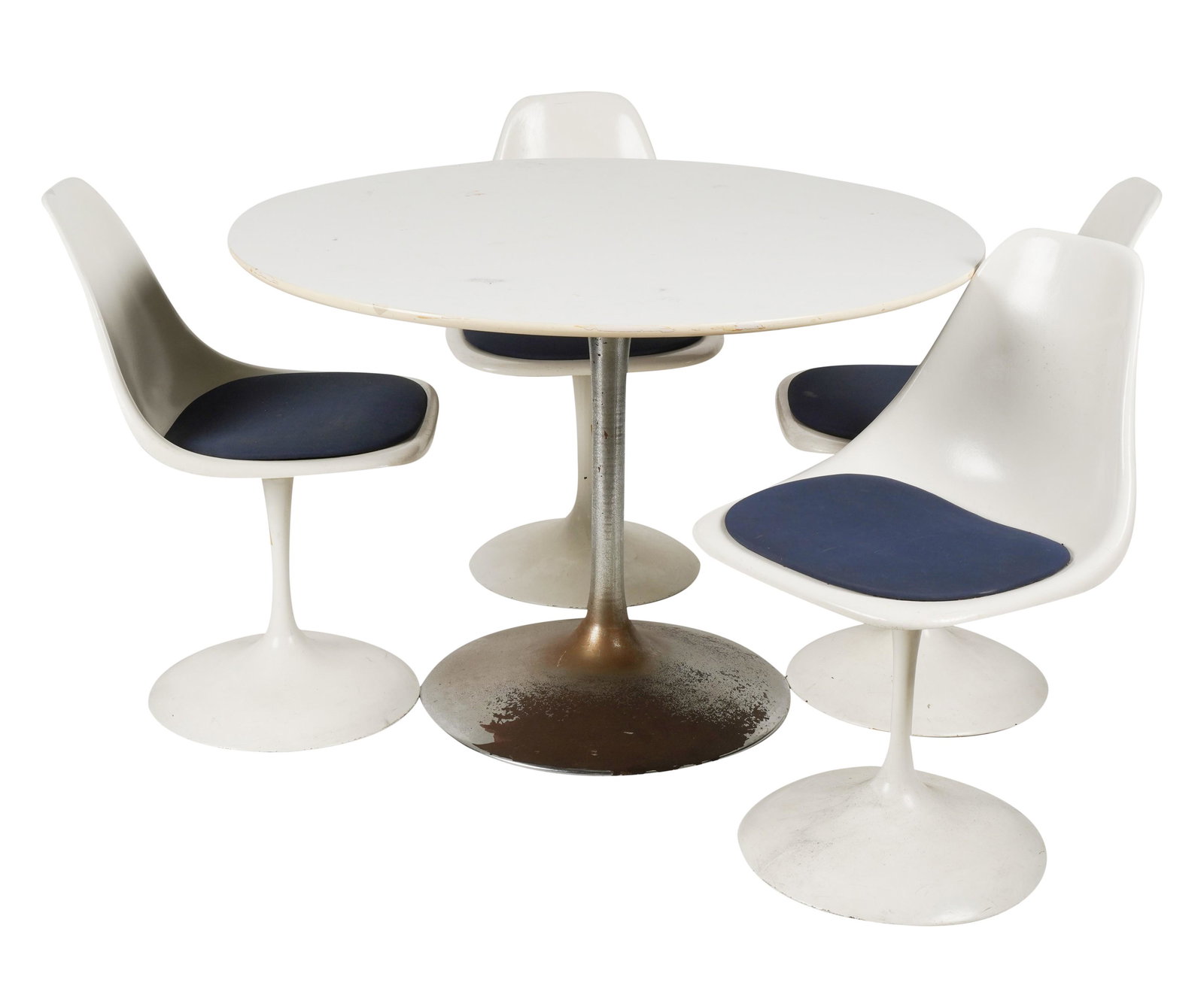 Style of Eero Saarinen: Tulip Dining Set: the table: white laminate and metal, unsigned, 28 1/2 x 42 in. (72.4 x 106.7 cm.); the four chairs: enameled metal, fiberglass and blue upholstery, with manufacturer's label "Contemporary Shells Inc..
