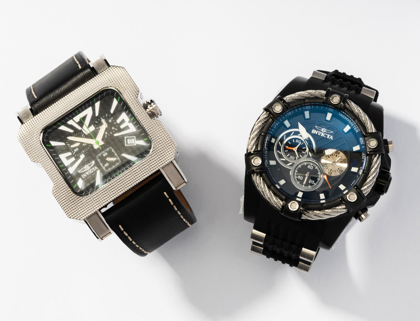 Pair of Invicta watches: Including a Gent's stainless-steel INVICTA "Bolt" wristwatch with stainless-steel case and cable bezel surrounding a 39.00 mm. round black dial with luminescent sword shape hour and minute hands, red