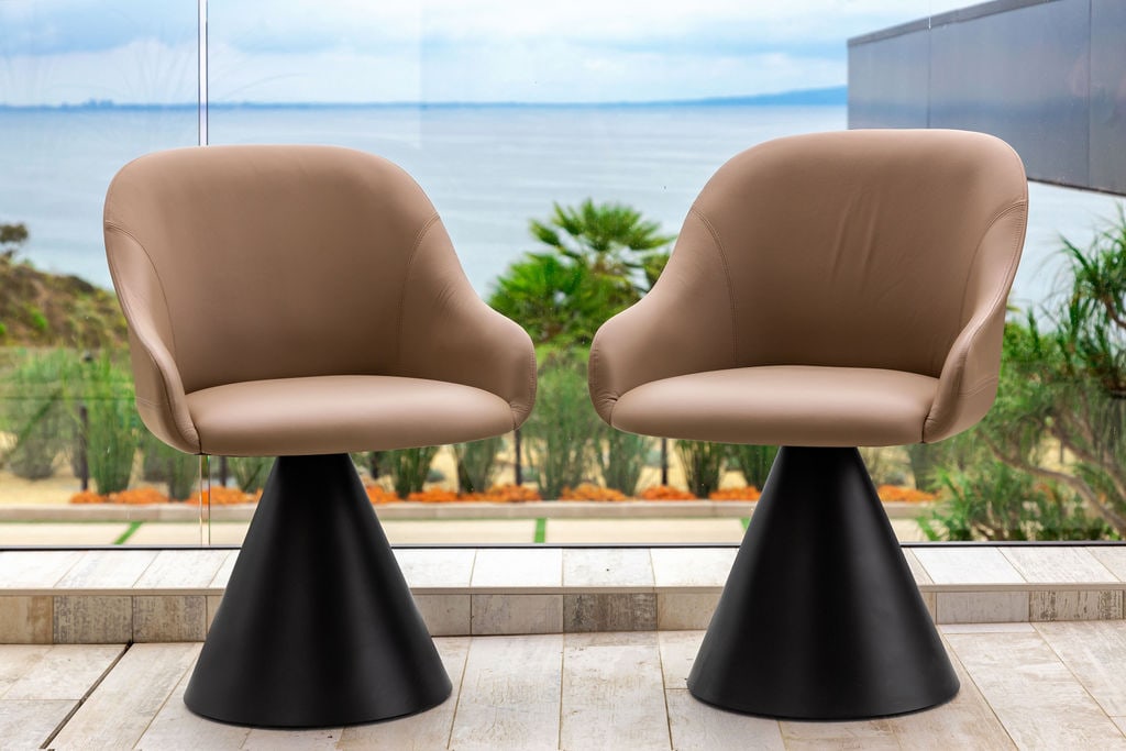 Pair of Potocco Italy Lyz Small Swivel Armchairs: designed by Mario Ferrarini; covered in taupe leather 31 1/2 x 22 x 20 in. (80 x 55.9 x 50.8 cm.), Seat height: 19 in. (48.3 cm.) Provenance: Property from a Private Residence, Carbon Beach, Malibu, C