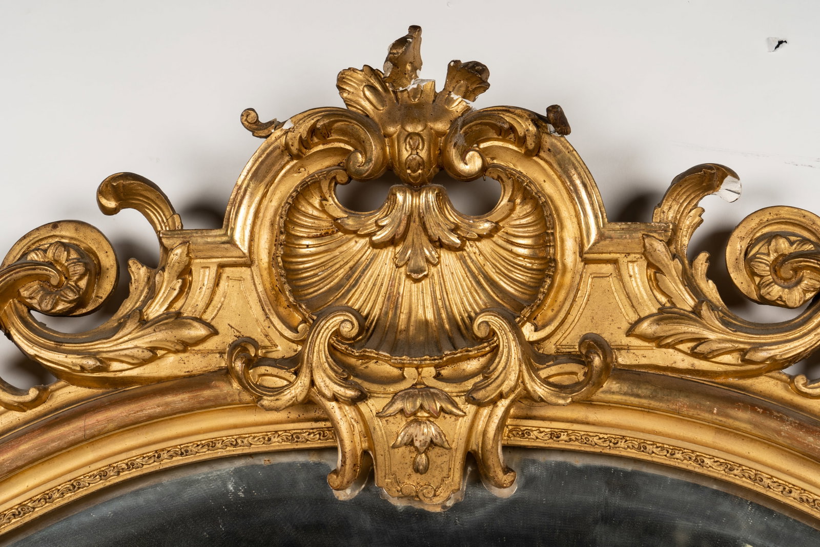 Continental Carved Giltwood Wall Mirror: with beveled mirror plate 82 x 47 1/2 x 2 1/2 in. (208.3 x 120.7 x 6.4 cm.)