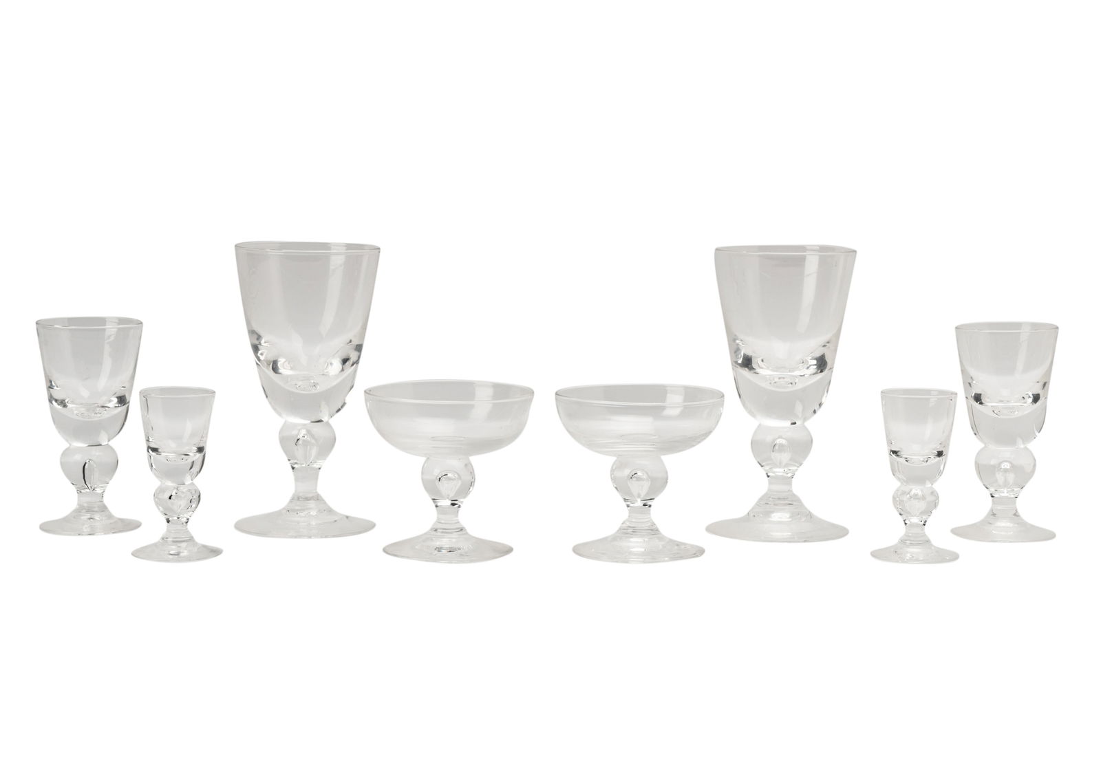 Steuben Glass Stemware Service: comprising six water goblets (6 3/4 in. high); five wine (5 in. high); one wine (5 1/8 in. high); six champagne coupes (3 3/4 x 4 in.); and six cordials (3 3/4 in. high) [24 pieces]