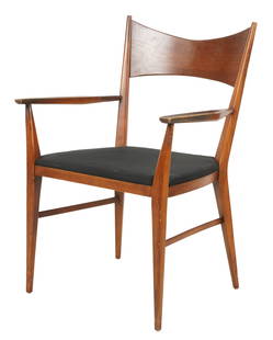 Paul McCobb for Calvin Furniture: Armchair: Grand Rapids, Michigan; walnut, black fabric; with manufacturer's metal tag and paper label 35 x 23 x 22 in. (88.9 x 58.4 x 55.9 cm.), Seat Height: 18 in. (45.7 cm.)