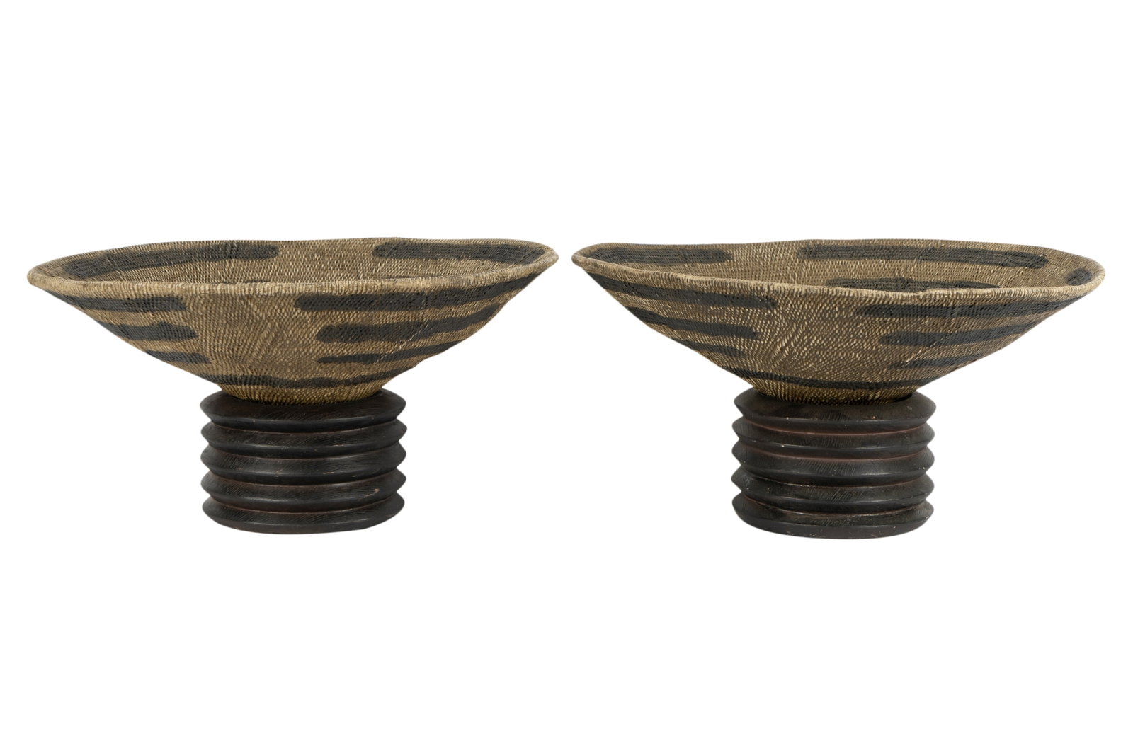 Pair of Woven Baskets on Wooden Pedestals: Each overall: 8 x 17 in. (20.3 x 43.2 cm.)