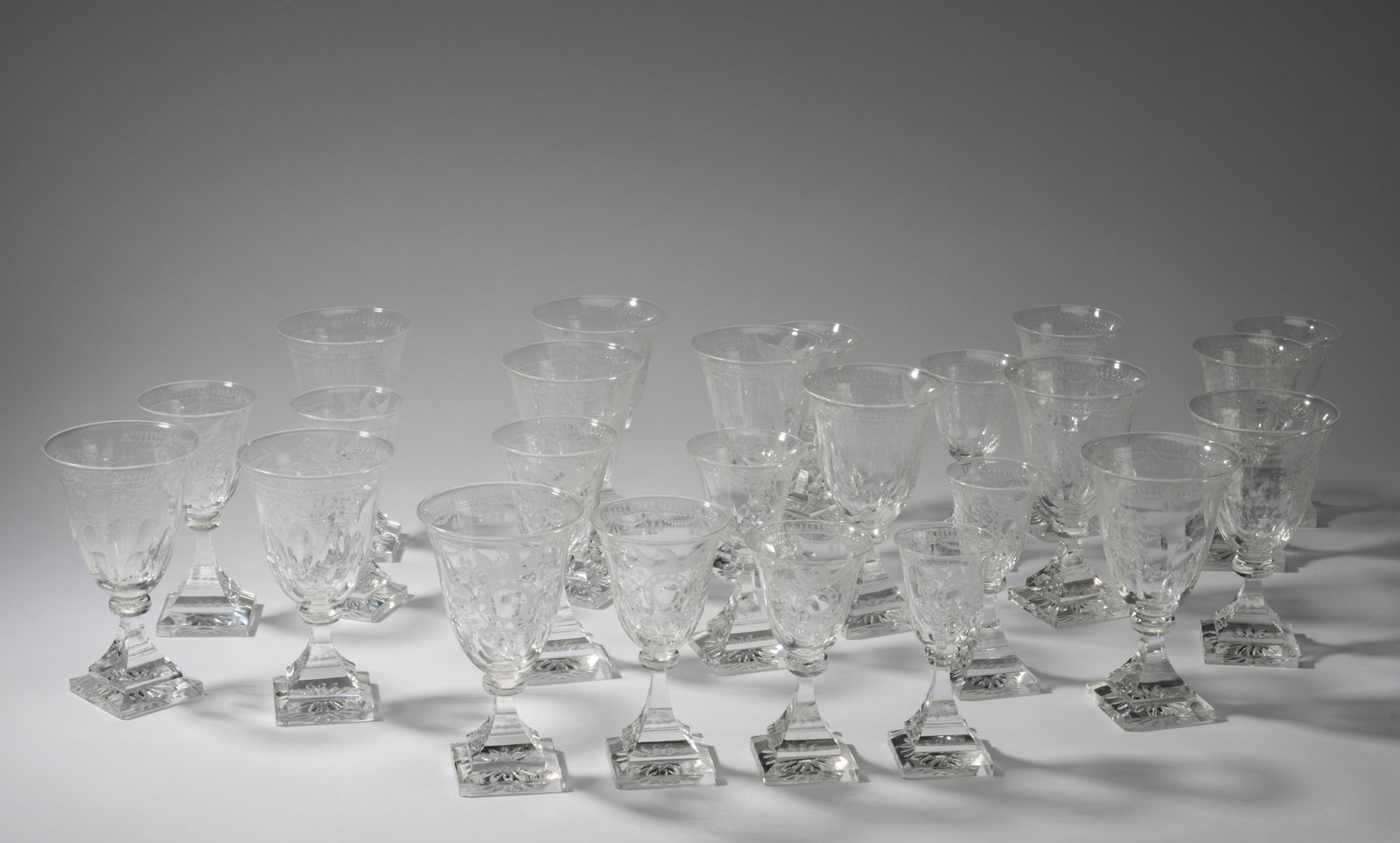 Steuben "Strawberry Mansion" Etched Glass Stemware Service: each marked "S"; comprising 11 water goblets (6 in. high), 5 claret wine (5 3/4 in. high), 6 port wine (5 1/2 in. high), and 2 cordials (5 1/4 in. high) [24 pieces]