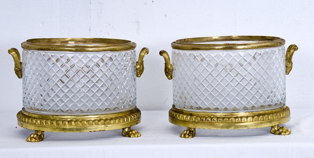 PAIR OF CHARLES X STYLE CUT CRYSTAL AND DORE BRONZE: 20th century with a molded rim and paw feet 16 inches wide; 10 1/2 inches high