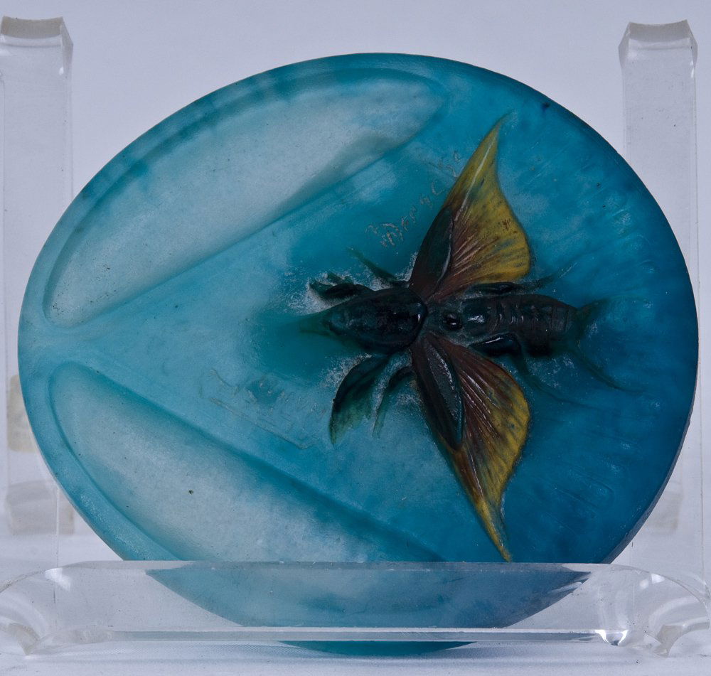 HENRI BERGE PATE-DE-VERRE VIDE POCHE: manufactured by Amalric Walter, molded in relief with a moth against a background of pyramids marked "A WALTER NANCY" and "Berge" 4 1/2 inches diameter