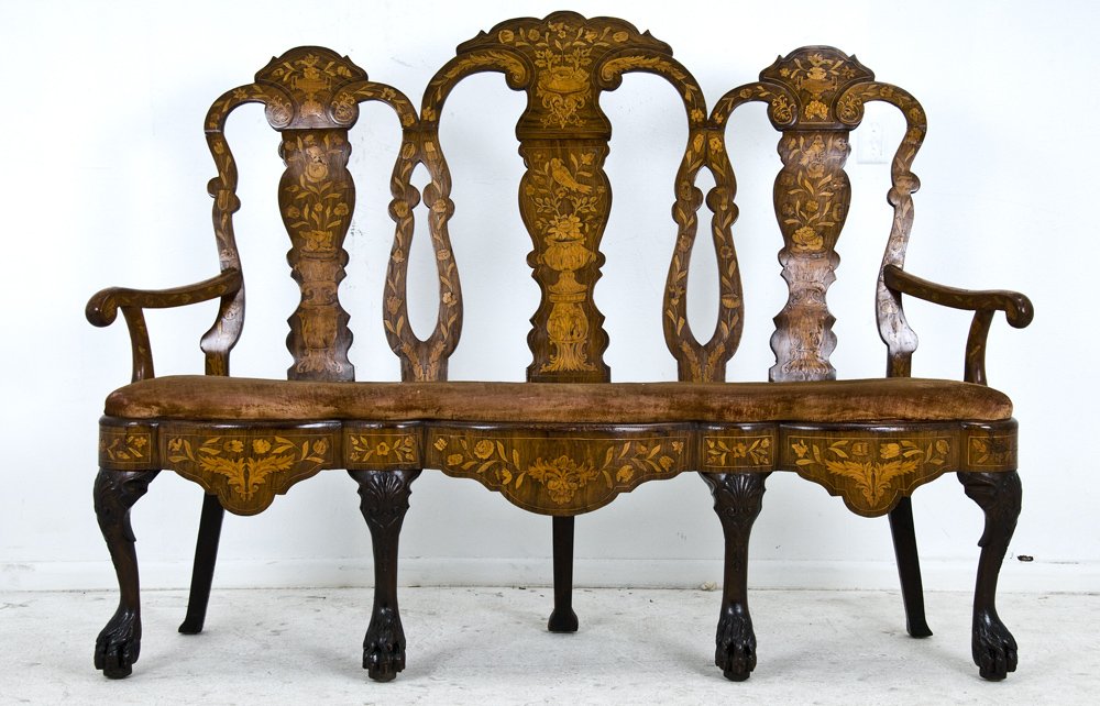 DUTCH BAROQUE MAHOGANY AND MARQUETRY SETTEE: the floral inlaid triple back above a scalloped apron and claw and ball supports 66 inches long