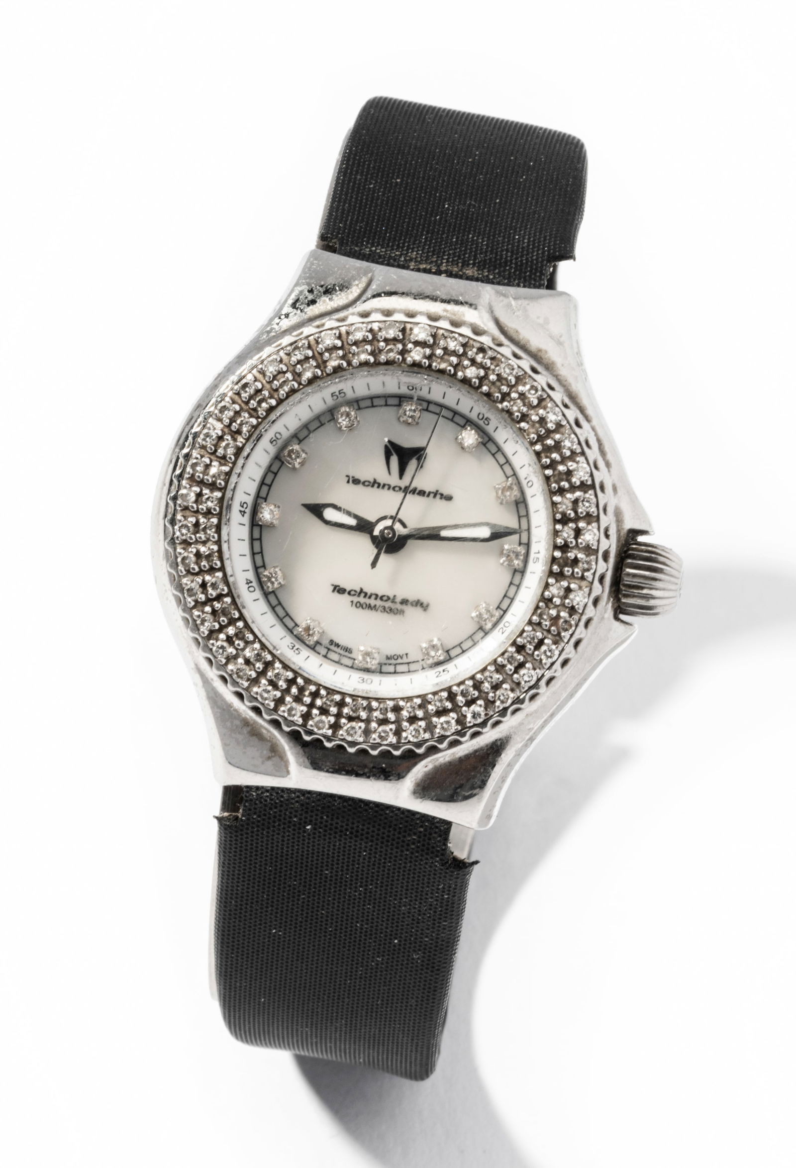 TechnoMarine TechnoLady Stainless Steel, Mother-of-Pearl and Diamond wristwatch: Stainless steel Technomarine "TechnoLady" stainless steel quartz movement wristwatch with 20.00 mm. in diameter round Mother-of-Pearl dial, luminescent and silver-tone hour and minute hands, silver-to