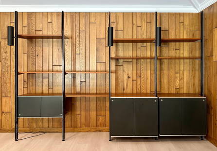 George Nelson (1908-1986): Four-Bay Comprehensive Storage System (CSS): Herman Miller, Zeeland, Michigan; comprising three two-panel black laminate cabinets, each with one interior walnut shelf; seven single walnut shelves; and three black up/down adjustable lights, all