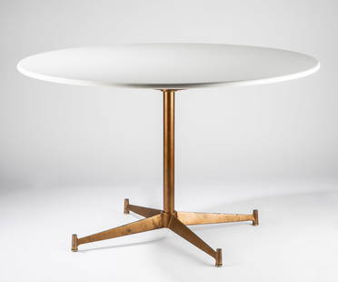 Paul McCobb (1917 - 1969): Round Table: brass, with associated Caesarstone top; unsigned 25 7/8 x 42 1/4 in. (65.7 x 107.3 cm.) Provenance: Property from The Watt Estate's Harbor Island Time Capsule, Newport Beach, California