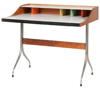 George Nelson (1908-1986): Swag-Leg Desk: model 5850, Herman Miller, Zeeland, Michigan, 1950s; walnut, laminate, chrome-plated steel, painted wood, molded plastic; unsigned 34 1/2 x 39 x 29 in. (87.6 x 99.1 x 73.7 cm.) Provenance: Property fr