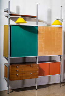 George Nelson (1908-1986): Two-Bay Comprehensive Storage System (CSS): Herman Miller, Zeeland, Michigan, c. 1960s; aluminum, walnut, enameled masonite, cork; with two swiveling lamps with yellow plastic shades; stamped "Herman Miller" to drawer pull Overall excluding lam