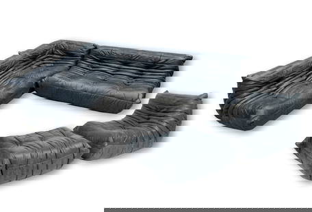 Michel Ducaroy: Togo Sectional Sofa: manufactured by Ligne Roset; charcoal grey leather, foam; comprising two side sections (27 x 52 x 29 in. and 27 x 66 x 29 in.), one corner section (27 x 36 x 29 in.), and one chair (27 x 34 x 29 in.)