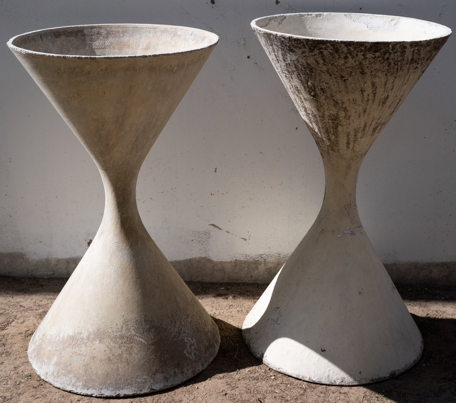 Willy Guhl (1915-2004): Pair of Diabolo Planters: manufactured by Eternit, Switzerland; fiber-reinforced concrete Approximately 38 1/4 x 22 in. (97.2 x 55.9 cm.)