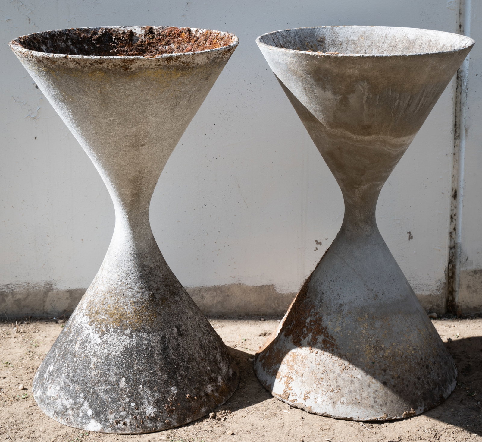 \Willy Guhl (1915-2004): Pair of Diabolo Planters: manufactured by Eternit, Switzerland; fiber-reinforced concrete Approximately 36 x 21 1/2 in. (91.4 x 54.6 cm.)