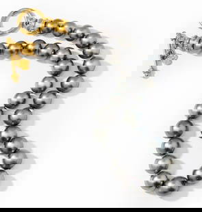 Nerso High Karat Yellow Gold Tahitian Pearl Necklace: Single slightly graduated strand-style necklace completed with yellow gold toggle clasp and terminals, strung with 27 spherical drilled Gray Tahitian Cultured Pearls, 12.04 mm. to 14.81 mm. each in di