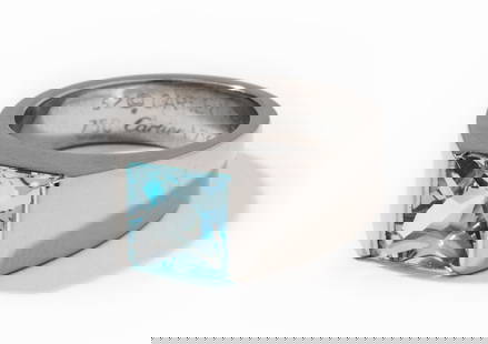Cartier 18 Karat White Gold and Aquamarine Ring: ring center channel set with one square buff-top Aquamarine, approximately 2.29 carats, 13.5 grams, size 6-1/4;