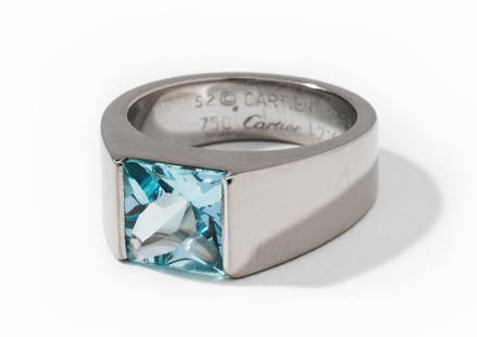 Cartier 18 Karat White Gold and Aquamarine Ring: ring center channel set with one square buff-top Aquamarine, approximately 2.29 carats, 13.5 grams, size 6-1/4;