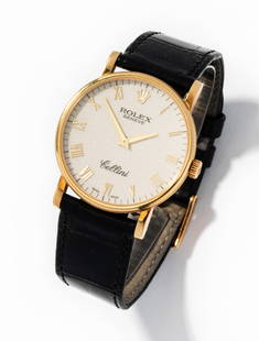 Rolex 18 Karat Yellow Gold "Cellini" Mechanical Movement Watch: manual wind wristwatch with 31.00 mm. round ivory colored textured dial, gold lance shape hour and minute hands, gold Roman numeral hour positions, signed "ROLEX" and "GENEVE" under the 12:00 position