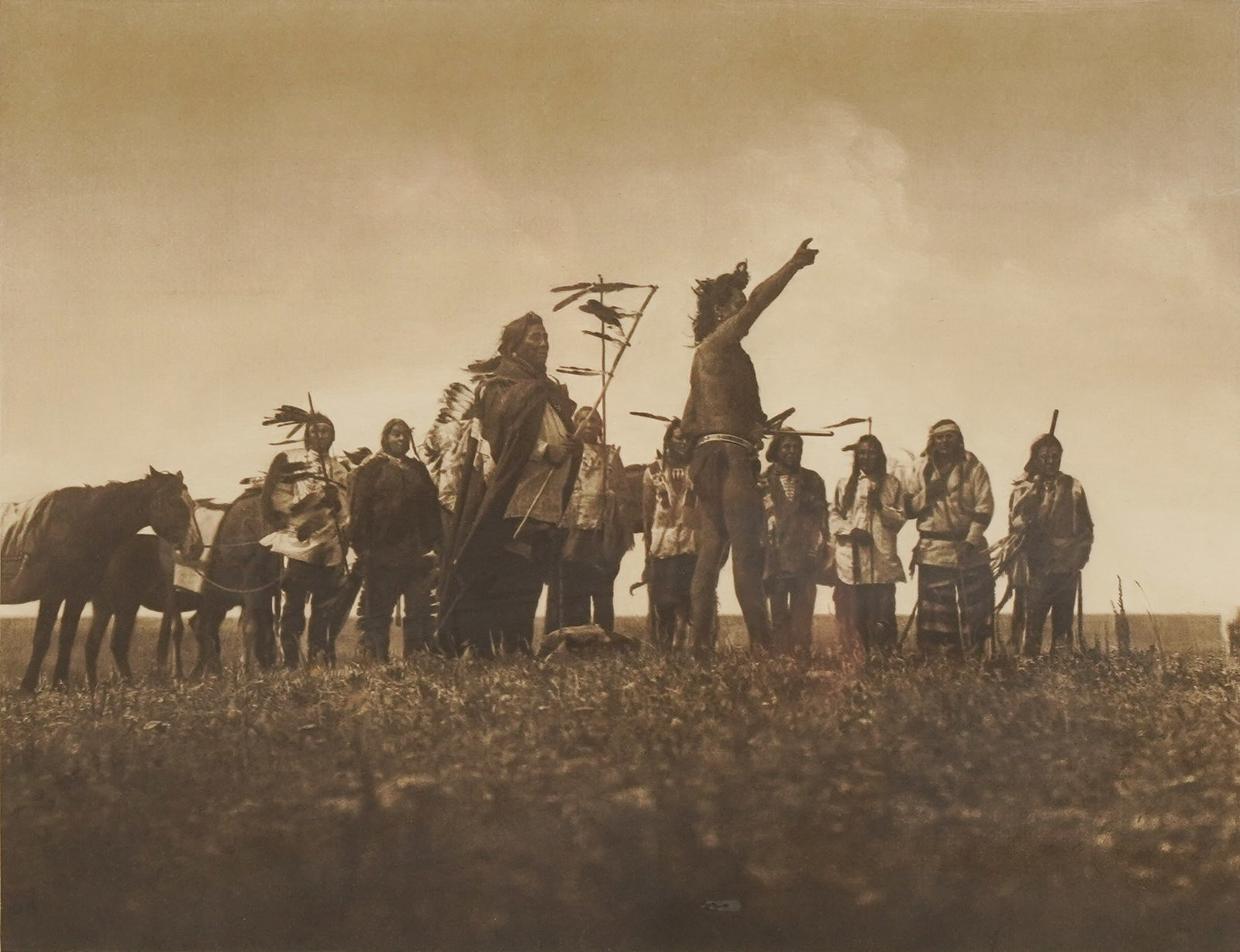 After Edward Curtis: The Scout's Report - Atsina: photogravure; printed by John Andrew and Son Sight: 13 x 16 1/2 in. (33 x 41.9 cm.), Frame: 20 x 23 1/2 in. (50.8 x 59.7 cm.)